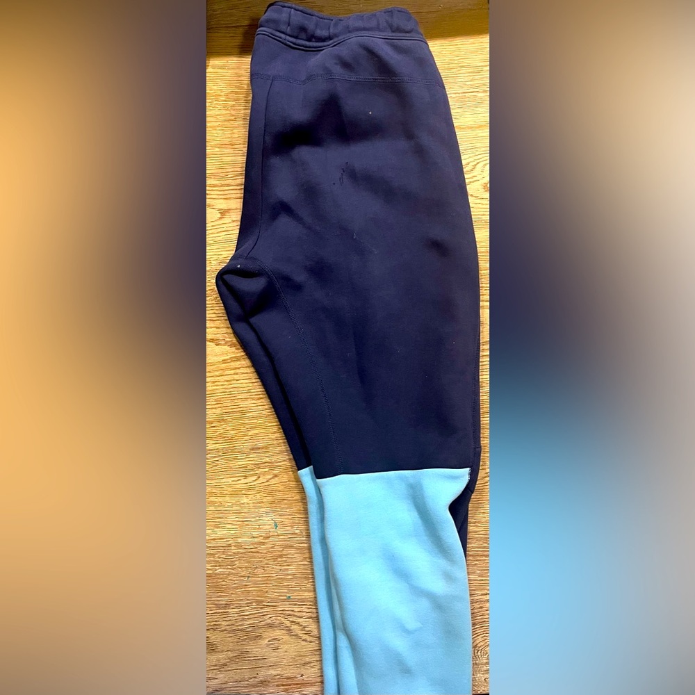 Light and Navy blue nike tech pants